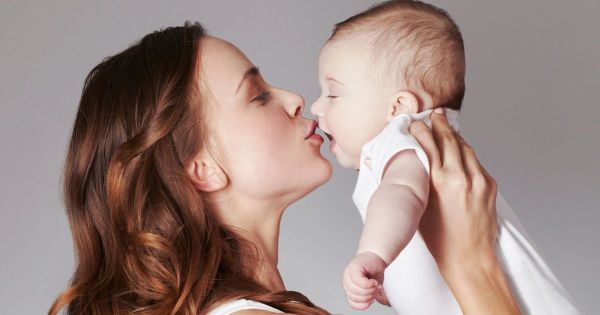 mother kissed baby with cold sore